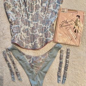 Two piece corset set with silk stockings.